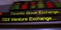 TMX Group tickers move across banners in Toronto on May 10, 2013. The Toronto stock market looks headed for another gain during a shortened, pre-holiday session. THE CANADIAN PRESS/Frank Gunn