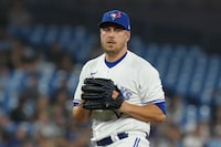 Toronto Blue Jays relief pitcher Erik Swanson pauses during American League MLB baseball action against the Houston Astros in Toronto on Thursday, June 8, 2023. The Blue Jays have reinstated Swanson from the 15-day injured list. THE CANADIAN PRESS/Chris Young
