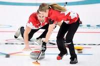 Canada's Kaitlyn Lawes and teammate John Morris play their stone during mixed doubles gold-medal curling action against Switzerland at the Olympic Winter Games in Gangneung, South Korea on Tuesday, February 13, 2018. For mixed doubles curlers in Canada, the next Olympic Games are coming fast. Curling Canada's changes to qualification means the country will know its 2026 representative in just over nine months, and well over a year out from the Winter Games in Milan and Cortina, Italy. THE CANADIAN PRESS/Nathan Denette