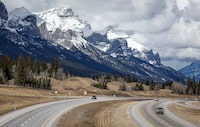 Traffic travels along the Trans Canada Highway past Mount Rundle of the Rocky Mountains near Canmore, Alta., Monday, April 24, 2023. Documents released under Alberta Freedom of Information laws confirm the United Conservative government was talking with the coal industry for "years" about relaxing a policy that protected the Rocky Mountains from open-pit mines. THE CANADIAN PRESS/Jeff McIntosh