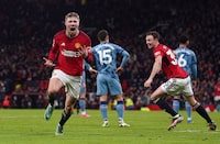 Manchester United's Rasmus Hojlund celebrates scoring their side's third goal during the English Premier League soccer match between Manchester United and Aston Villa at the Old Trafford stadium in Manchester, England, Tuesday, Dec. 26, 2023. (Martin Rickett/PA via AP)