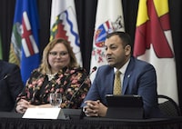 Yukon Deputy Premier Ranj Pillai takes questions from the media as Alberta deputy premier Sarah Hoffman looks on at the Western Premiers' Conference in Yellowknife, N.T., Wednesday, May 23, 2018 THE CANADIAN PRESS/Pat Kane