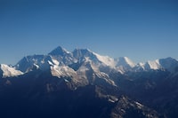 FILE PHOTO: Mount Everest, the world highest peak, and other peaks of the Himalayan range are seen through an aircraft window during a mountain flight from Kathmandu, Nepal January 15, 2020. REUTERS/Monika Deupala//File Photo/File Photo