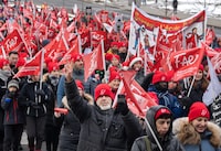 Striking teachers with the FAE union march through the streets to press their contract demands Tuesday, December 12, 2023  in Montreal.