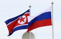 FILE PHOTO: Russian and North Korean flags fly at the Vostochny Сosmodrome, the venue of the meeting between Russia's President Vladimir Putin and North Korea's leader Kim Jong Un, in the far eastern Amur region, Russia, September 13, 2023. Sputnik/Artem Geodakyan/Pool via REUTERS/File Photo