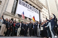 Guests and Oliver Reichert (C), Global CEO of BIRKENSTOCK, attend as BIRKENSTOCK goes public on the NYSE at the New York Stock Exchange on Oct. 11.