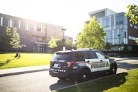 A Waterloo Regional Police vehicle is seen at the scene of a stabbing at the University of Waterloo, in Waterloo, Ont., Wednesday, June 28, 2023. Waterloo Regional Police said three victims were stabbed inside the university's Hagey Hall, with one person was taken into custody. THE CANADIAN PRESS/Nick Iwanyshyn