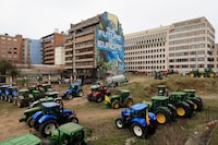 Farmers park their tractors near the European Council building in Brussels during a demonstration on Tuesday, March 26, 2024. Dozens of tractors sealed off streets close to European Union headquarters where the 27 EU farm ministers are meeting to discuss the crisis in the sector which has led to months of demonstrations across the bloc. (AP Photo/Geert Vanden Wijngaert)