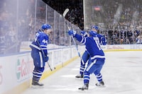 Toronto Maple Leafs defenceman Morgan Rielly (44) celebrates his goal with teammates Mitchell Marner (16) and defenceman TJ Brodie (78) during second period NHL action against the Washington Capitals in Toronto on Sunday, Jan. 29, 2023. THE CANADIAN PRESS/Cole Burston