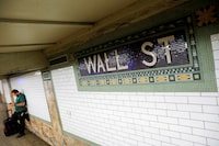 A person waits on the Wall Street subway platform in the Financial District of Manhattan, New York City, U.S., August 20, 2021.
