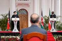 Iran's President Ebrahim Raisi, left, and Kenya's President William Ruto, right, give a joint press conference after meeting at State House in Nairobi, Kenya, Wednesday, July 12, 2023. Iran's president has begun a rare visit to Africa as the country, which is under heavy U.S. economic sanctions, seeks to deepen partnerships around the world. (AP Photo/Khalil Senosi)