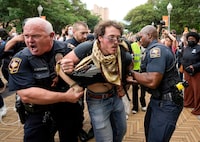 University of Texas Police detain a man at a pro-Palestinian protest at the University of Texas, during the ongoing conflict between Israel and the Palestinian Islamist group Hamas, in Austin, Texas, U.S., April 24, 2024.   Jay Janner/Austin Statesman/USA Today Network via REUTERS NO RESALES. NO ARCHIVES. MANDATORY CREDIT     TPX IMAGES OF THE DAY      REFILE - CORRECTING FROM "TEXAS STATE TROOPERS" TO "UNIVERSITY OF TEXAS POLICE".
