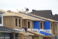 New homes are constructed in Ottawa on Monday, Aug. 14, 2023. The Bank of Canada's next rate announcement is unlikely to spur much immediate movement in the national housing market, but economists say it may be just a matter of months until buyers come crawling back from the sidelines. THE CANADIAN PRESS/Sean Kilpatrick