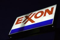 (FILES) An Exxon sign is displayed at a station in Manassas, Virginia, on September 20, 2008. ExxonMobil reported lower profits on October 27, 2023, compared with the year-ago blowout quarter as the oil giant touted recent acquisitions it said balance economic and environmental priorities. The petroleum giant reported third-quarter profits of $9.1 billion, less than half the level in the 2022 period of booming commodity prices. Revenues fell 19 percent to $90.8 billion. (Photo by Karen BLEIER / AFP) (Photo by KAREN BLEIER/AFP via Getty Images)