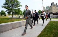 Prime Minister Justin Trudeau makes his way into the West Block after attending a commemorative ceremony, Raising the SurvivorsÕ Flag, on Parliament Hill in Ottawa on Wednesday, June 21, 2023. The ceremony is "in memory of the thousands of children who were sent to residential schools, of those who never returned, and in honour of the families whose lives were forever changed." THE CANADIAN PRESS/Sean Kilpatrick