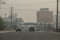 Heavy smoke from nearby wildfires fills the sky in Yellowknife on Tuesday, August 15, 2023. Residents of Yellowknife and a nearby First Nation have been told they'll be allowed home as early as Sept. 6, barring any increase in wildfire risk. THE CANADIAN PRESS/Angela Gzowski
