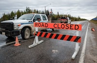 A state of emergency in the Northwest Territories has been extended until Sept. 11. The road is closed north to Yellowknife from Fort Providence, N.W.T., Thursday, Aug. 17, 2023. THE CANADIAN PRESS/Jeff McIntosh