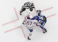Connor McDavid #97 of the Edmonton Oilers takes a faceoff against William Nylander #88 of the Toronto Maple Leafs during the third period in an NHL game at Scotiabank Arena on March 23, 2024 in Toronto, Ontario, Canada. The Maple Leafs defeated the Oilers 6-3.
