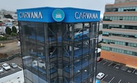 A sign is posted on the exterior of a Carvana car vending machine on July 19, 2023 in Daly City, California.