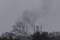 Smoke rises from Gaza, amid the ongoing conflict between Israel and the Palestinian Islamist group Hamas, as seen from southern Israel, January 17, 2024. REUTERS/Tyrone Siu