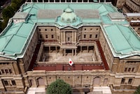 FILE PHOTO: Japanese national flag is hoisted atop the headquarters of Bank of Japan in Tokyo, Japan September 20, 2023.  REUTERS/Issei Kato/File Photo