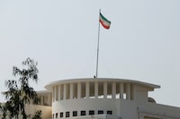 The flag of Iran is seen over its consulate building, after the Pakistani foreign ministry said the country conducted strikes inside Iran targeting separatist militants, two days after Tehran said it attacked Israel-linked militant bases inside Pakistani territory, in Karachi, Pakistan January 18, 2024. REUTERS/Akhtar Soomro