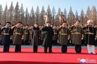 In this photo provided by the North Korean government, its leader Kim Jong Un, center, with his daughter, salutes as they visit the defense ministry for events to celebrate the 76th founding anniversary of the country's army in North Korea, Thursday, Feb. 8, 2024. Independent journalists were not given access to cover the event depicted in this image distributed by the North Korean government. The content of this image is as provided and cannot be independently verified. Korean language watermark on image as provided by source reads: "KCNA" which is the abbreviation for Korean Central News Agency. (Korean Central News Agency/Korea News Service via AP)