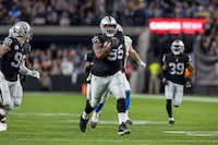 Las Vegas Raiders defensive tackle John Jenkins (95) recovers a fumble and runs for a touchdown against the Los Angeles Chargers in an NFL football game, Thursday, Dec. 14, 2023, in Las Vegas, NV. Raiders defeat the Chargers 63-21. (AP Photo/Jeff Lewis)