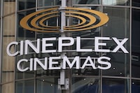 FILE PHOTO: A Cineplex movie theatre sign looms over Yonge street in Toronto, Ontario, Canada, March 16, 2020.  REUTERS/Chris Helgren/File Photo