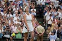 Ukraine's Elina Svitolina celebrates after beating Poland's Iga Swiatek to win their women's singles match on day nine of the Wimbledon tennis championships in London, Tuesday, July 11, 2023. (AP Photo/Kirsty Wigglesworth)