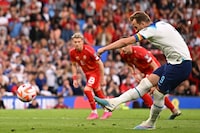 England's striker Harry Kane scores their seventh goal from the penalty spot during the UEFA Euro 2024 group C qualification football match between England and North Macedonia at Old Trafford in Manchester, north west England, on June 19, 2023. (Photo by Oli SCARFF / AFP) / NOT FOR MARKETING OR ADVERTISING USE / RESTRICTED TO EDITORIAL USE (Photo by OLI SCARFF/AFP via Getty Images)
