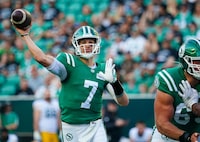 Saskatchewan Roughriders quarterback Trevor Harris (7) throws against the Edmonton Elks during the first half of CFL football action in Regina, on Thursday, July 6, 2023. Harris was named the top quarterback in the CFL's weekly honour roll Tuesday. THE CANADIAN PRESS/Heywood Yu