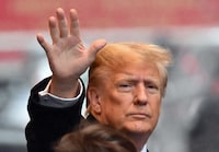 Former US President Donald Trump waves as he departs for his sexual assault defamation trial in New York on January 25.