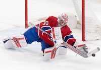 Montreal Canadiens goaltender Cayden Primeau makes a save against the Columbus Blue Jackets during third period NHL hockey action in Montreal on Tuesday, March 12, 2024. THE CANADIAN PRESS/Christinne Muschi
