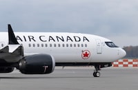 Air Canada reported a fourth-quarter profit of $184 million, up from $168 million a year earlier, as its operating revenue rose 11 per cent. An Air Canada jet taxis at the airport, Wednesday, Nov.15, 2023 in Vancouver.  THE CANADIAN PRESS/Adrian Wyld