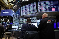 Traders work on the floor at the New York Stock Exchange (NYSE) in New York City, U.S., April 26.
