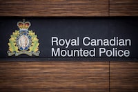 The RCMP logo is seen outside Royal Canadian Mounted Police "E" Division Headquarters, in Surrey, B.C., on Friday April 13, 2018. Fire officials in Chilliwack, B.C., say an early morning blaze at an apartment complex has displaced six families. They say neighbouring buildings were also damaged, but no one was injured and the cause of the fire is now under investigation by the RCMP and the fire department. THE CANADIAN PRESS/Darryl Dyck
