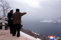 This picture taken on January 28, 2024 and released by North Korea's official Korean Central News Agency (KCNA) on January 29 shows North Korean leader Kim Jong Un (R) inspecting a test-fire of the submarine-launched strategic cruise missile "Pulhwasal-3-31" at an undisclosed location in North Korea. (Photo by KCNA VIA KNS / AFP) / - South Korea OUT / ---EDITORS NOTE--- RESTRICTED TO EDITORIAL USE - MANDATORY CREDIT "AFP PHOTO/KCNA VIA KNS" - NO MARKETING NO ADVERTISING CAMPAIGNS - DISTRIBUTED AS A SERVICE TO CLIENTS
THIS PICTURE WAS MADE AVAILABLE BY A THIRD PARTY. AFP CAN NOT INDEPENDENTLY VERIFY THE AUTHENTICITY, LOCATION, DATE AND CONTENT OF THIS IMAGE. /  (Photo by STR/KCNA VIA KNS/AFP via Getty Images)