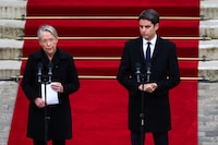 France's outgoing Prime Minister Elisabeth Borne delivers a speech next to newly appointed Prime Minister Gabriel Attal during the handover ceremony at the Hotel Matignon in Paris, France, on January 9, 2024. Emmanuel Dunand/Pool via REUTERS