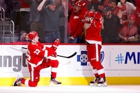 Apr 15, 2024; Detroit, Michigan, USA;  Detroit Red Wings left wing Lucas Raymond (23) celebrates with center Dylan Larkin (71) after he scores in overtime against the Montreal Canadiens at Little Caesars Arena. Mandatory Credit: Rick Osentoski-USA TODAY Sports