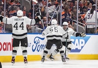 Los Angeles Kings' Mikey Anderson (44), Quinton Byfield (55) and Anze Kopitar (11) celebrate Kopitar's game-winning goal against the Edmonton Oilers during overtime NHL playoff action in Edmonton on Wednesday April 24, 2024.THE CANADIAN PRESS/Jason Franson 