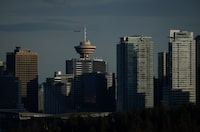 The downtown skyline is seen at sunset in Vancouver, on Thursday, April 13, 2023. THE CANADIAN PRESS/Darryl Dyck