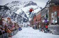 Walker Tidmarsh of Calgary, Alta., sails over a jump during the skijoring event in Banff national Park on January 20, 2024. LEAH HENNEL/THE GLOBE AND MAIL