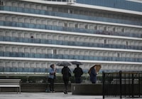 Cruises are surging back to popularity among Canadians this spring break, as more travellers look to try a mode of tourism they may have avoided since the COVID-19 pandemic. People use umbrellas to shield themselves from the rain as the Princess Cruises cruise ship Majestic Princess is seen docked at port, in Vancouver, B.C., Monday, Sept. 25, 2023. THE CANADIAN PRESS/Darryl Dyck