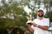 PONTE VEDRA BEACH, FLORIDA - MARCH 17: Scottie Scheffler of the United States poses with the trophy after winning THE PLAYERS Championship at TPC Sawgrass on March 17, 2024 in Ponte Vedra Beach, Florida. (Photo by Jared C. Tilton/Getty Images)