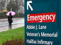 A large hospital complex in Halifax has been hit by its second water main break in as many days forcing the cancellation of some surgeries and leaving no running water for flushing toilets or drinking. A person heads past the Halifax Infirmary in Halifax on Tuesday, April 24, 2012. THE CANADIAN PRESS/Andrew Vaughan