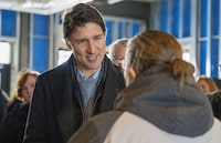 Prime Minister Justin Trudeau speaks to a community member at a housing announcement in Guelph, Ontario on Friday January 12, 2024. The southwestern Ontario city of Guelph is getting $21.4 million from the federal government to help fast-track the construction of new homes. THE CANADIAN PRESS/Frank Gunn
