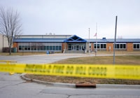 Tape blocks all entrances at the Perry Middle School and High School building on Friday, Jan. 5, 2024, in Perry, Iowa. A day after a shooting sent bullets flying inside the small-town Iowa high school, leaving a sixth grader dead and others wounded, the community of Perry is somber.   (AP Photo/Bryon Houlgrave)