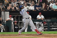 Toronto Blue Jays' Vladimir Guerrero Jr. watches his two-run home run against the Chicago White Sox during the eighth inning of a baseball game Tuesday, July 4, 2023, in Chicago. (AP Photo/Matt Marton)