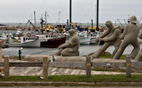 A sculpture shows fishermen pulling on a line in front of the marina, Monday, August 6, 2012, in L'Étang du Nord on the Îles-de-la-Madeleine. THE CANADIAN PRESS/Jacques Boissinot